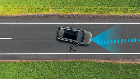 The system uses the front camera to detect lane drift and provides audio visual warnings. The steering wheel makes adjustments to keep the vehicle in line and avoid accidents.